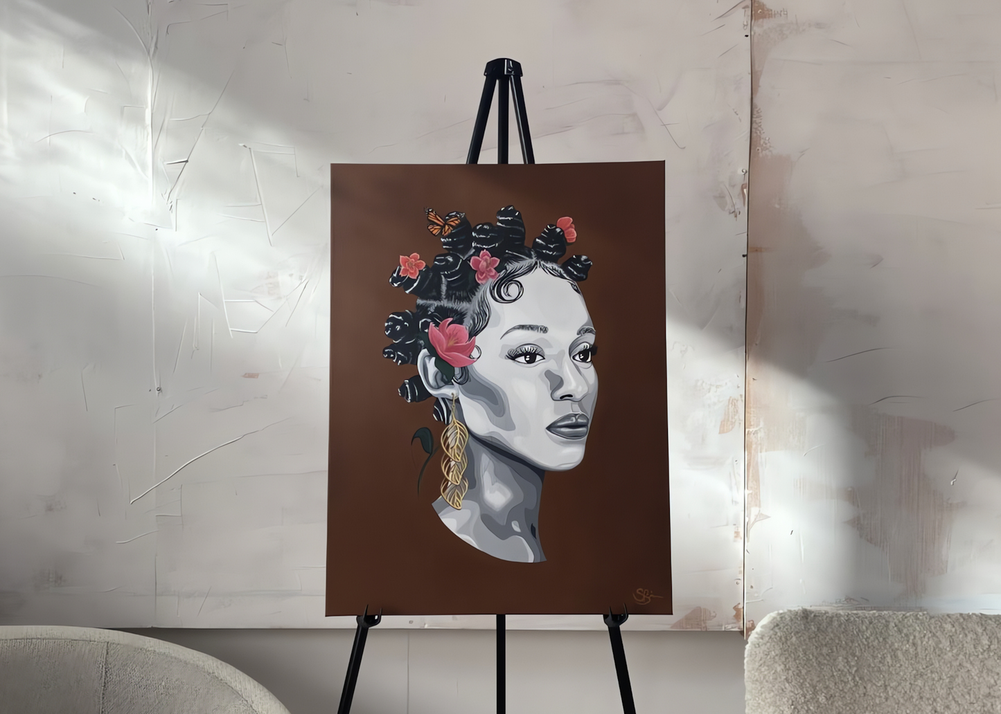 A portrait painting on a canvas displayed on a black easel. The artwork depicts a woman's face in grayscale with dark hair adorned by pink and orange flowers, set against a solid brown background.