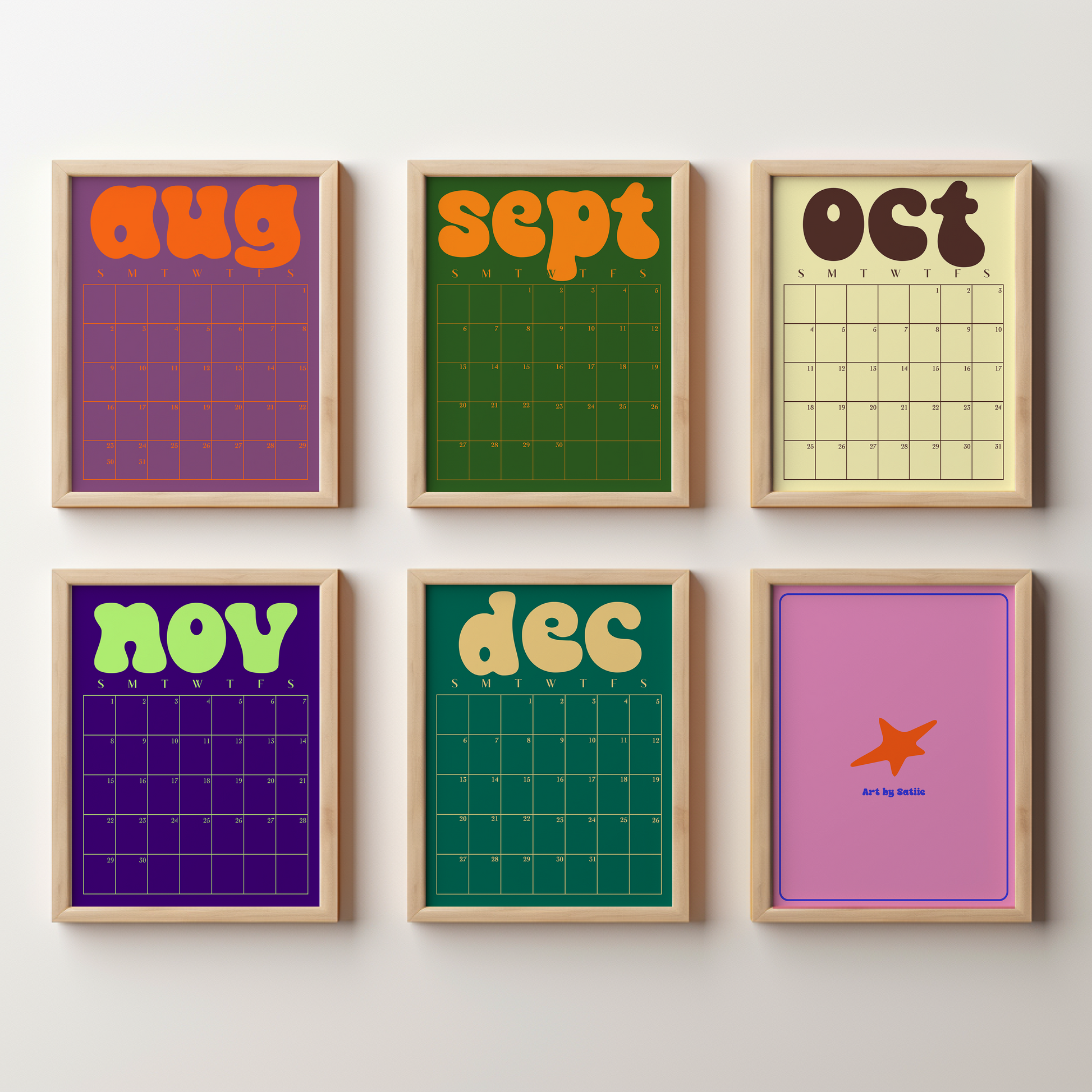 Six framed monthly calendar prints arranged in a 2x3 grid on a light wall. The prints feature retro 1970s-style designs with bold retro text for each month (aug, sept, oct, nov, dec, and an airplane graphic for december) in various vibrant colors on purple, green, yellow, and pink backgrounds, all enclosed in light wood frames.